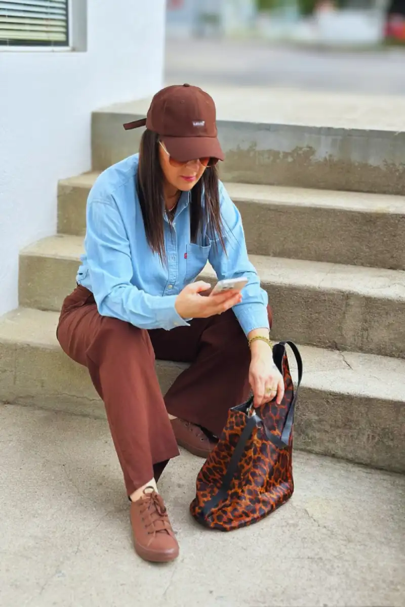 Close up of a chambray shirt and brown wide-leg pants outfit - Inspiration 2