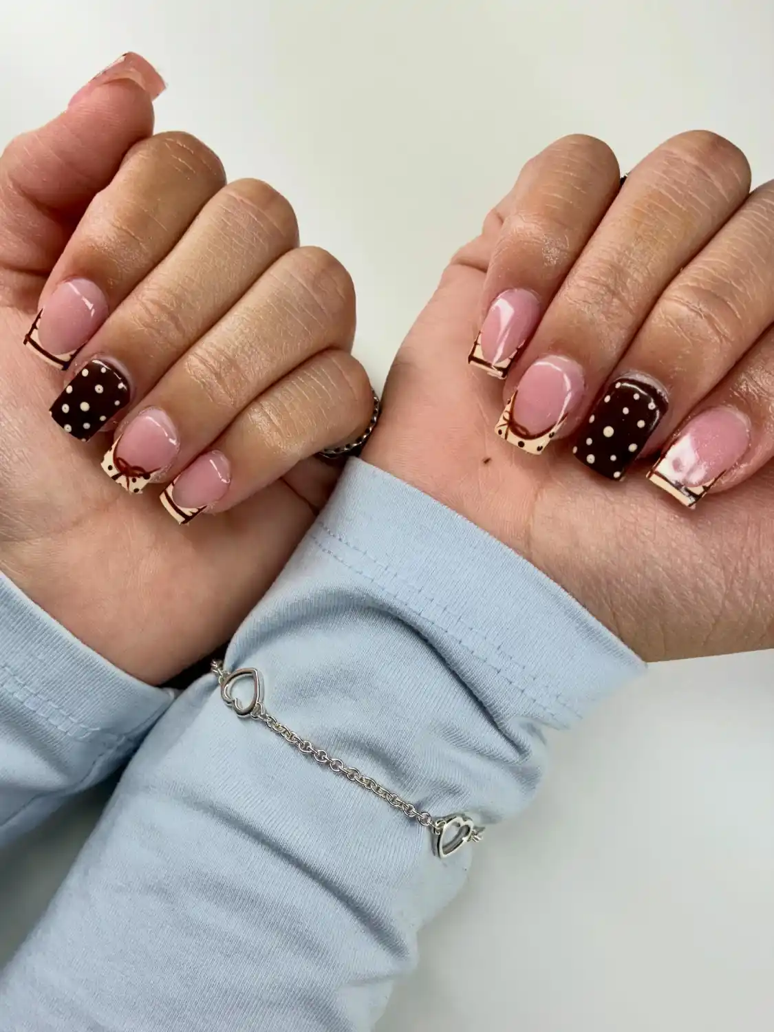 Chocolate polka dot nails with tiny bows - Nail inspiration 3