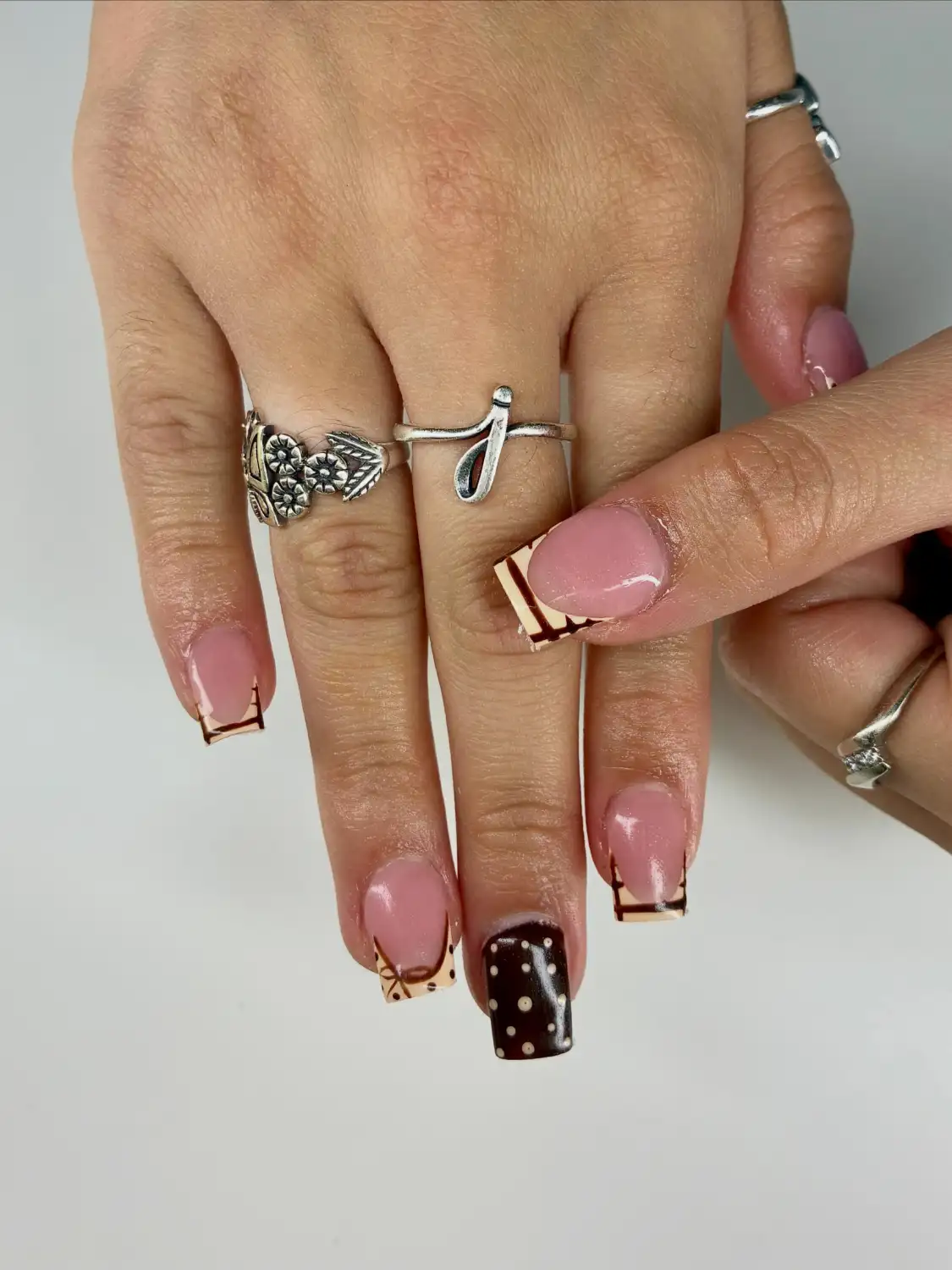 Chocolate polka dot nails with tiny bows - Nail inspiration 4